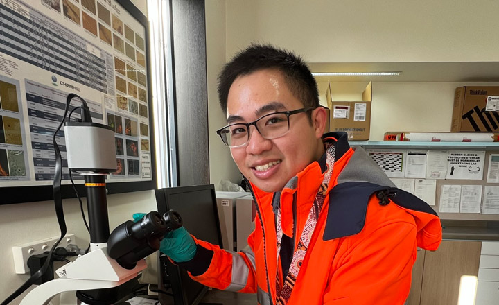 A photograph of Process Engineer Josh Mah in the science lab