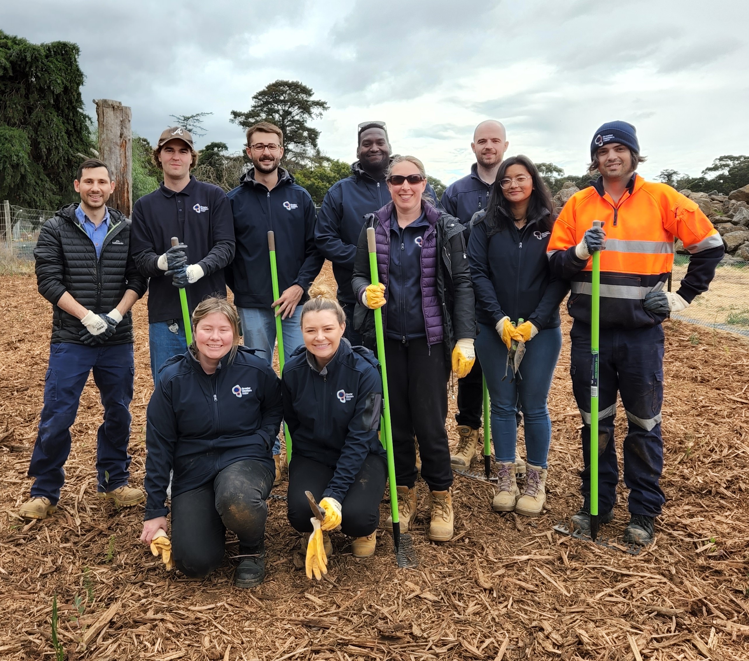 GWW staff in safety gear pose with shovels at the Werribee Open Range Zoo