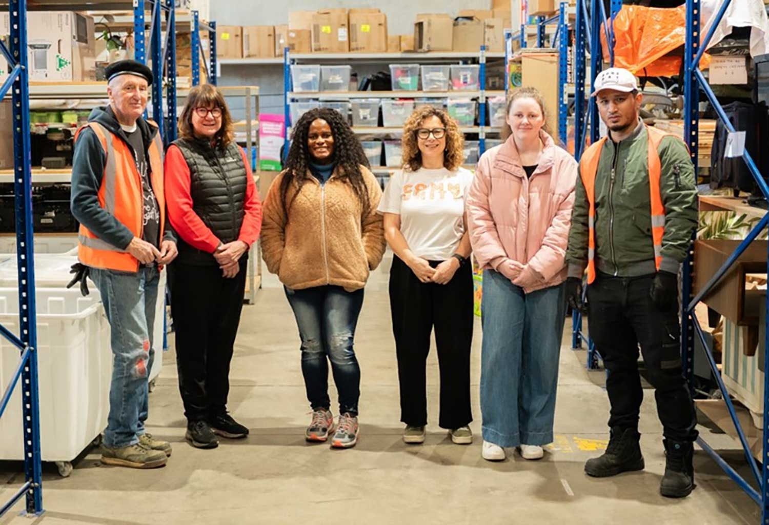 West Welcome Wagon volunteers and staff members  in their Sunshine West warehouse.