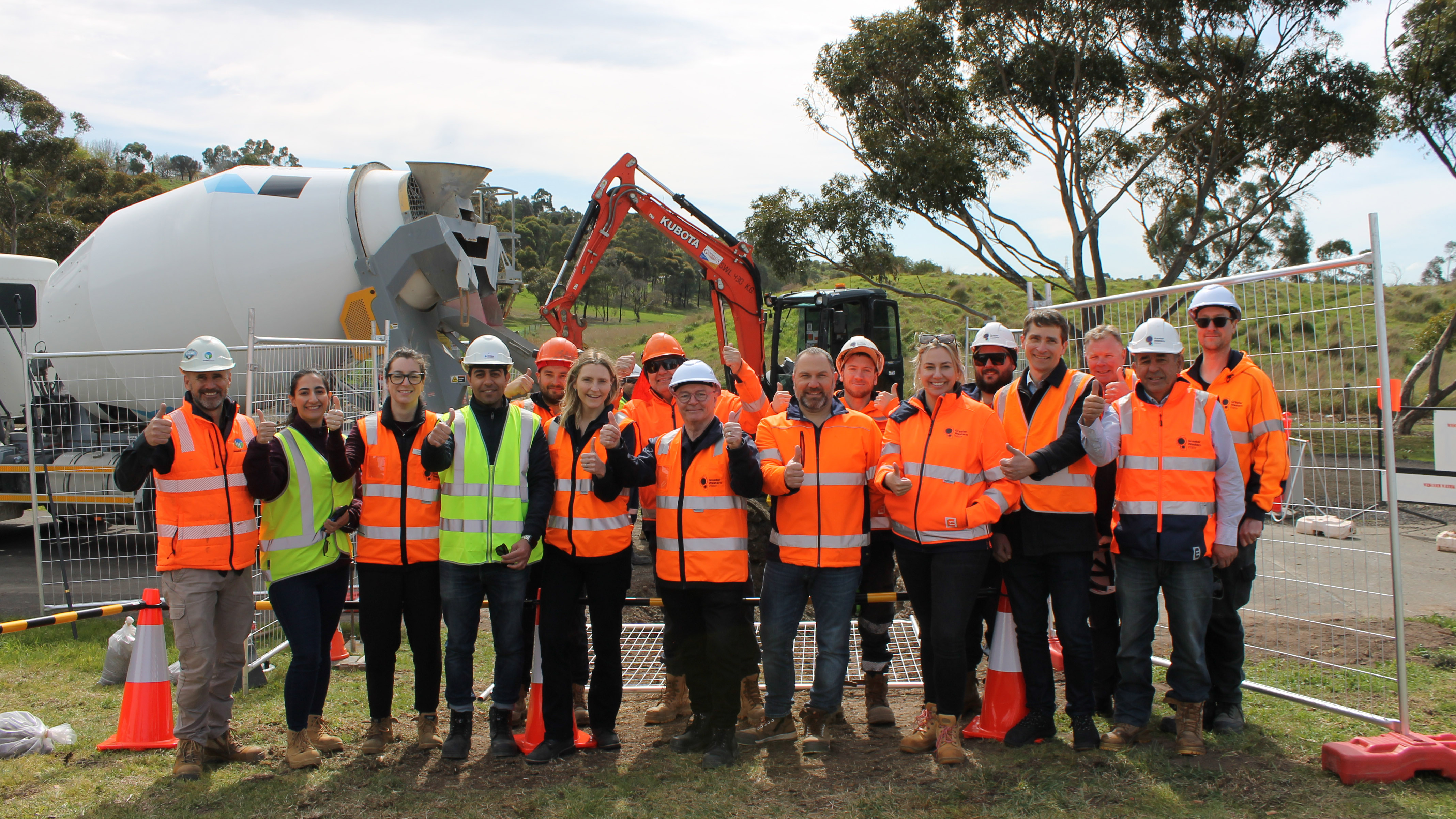 Group of people in high-visibility clothing at a work site 