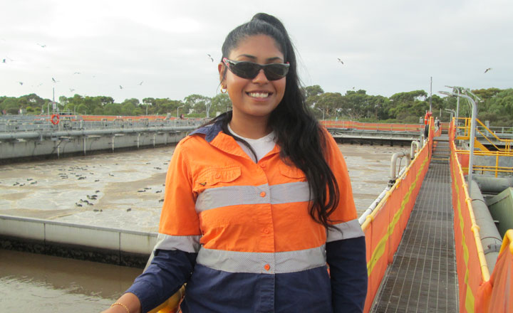 Roshi wearing her GWW uniform standing at a recycled water plant