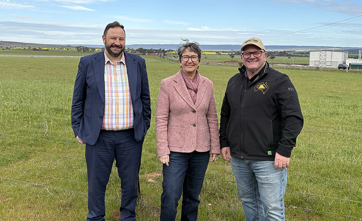 GWW Managing Director Cameron FitzGerald, Minister for Water Michaela Settle and Parwan farmer Pietro Failli in front of a field receiving recycled water thanks to the Western Irrigation Project (WIN).