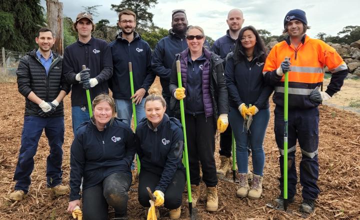 GWW staff in safety gear pose with shovels at the Werribee Open Range Zoo