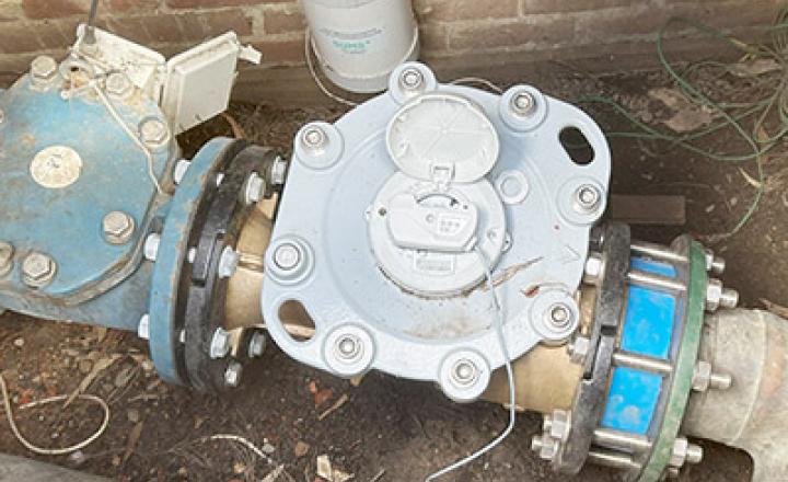 A digital monitoring device attached to a main water meter