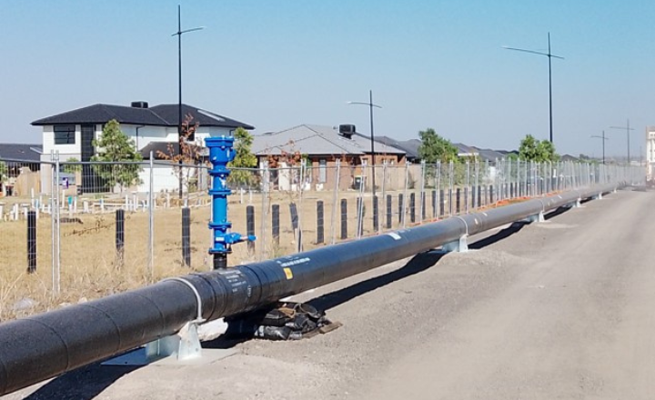 An above ground pipeline nearby a residential area 