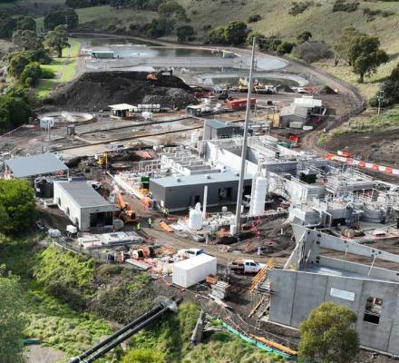An aerial view of the construction works being undertaken at the facility. The image shows several buildings being constructed.