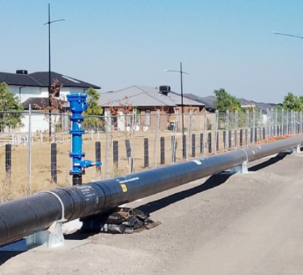 An above ground pipeline nearby a residential area 